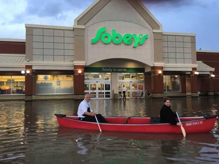 The owners of the Westlock Sobeys, Susan and Tom, canoe in the parking lot Monday, Aug. 22, 2016.