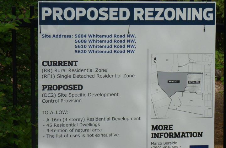 A sign outlining a controversial rezoning proposal for a proposed condo development in Edmonton’s River Valley.