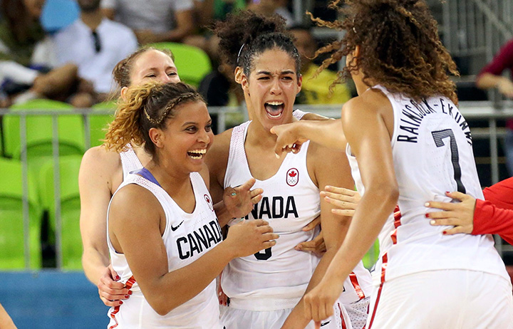 Canada’s Miah-Marie Langlois, Kia Nurse and Nayo Raincock-Ekunwe celebrate after beating Serbia in Group B action on August 8, 2016 Rio de Janeiro, Brazil. 