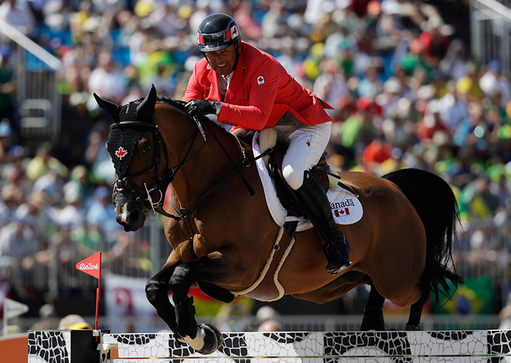 Canada's Yann Candele, riding First Choice 15, competes in the equestrian jumping competition at the 2016 Summer Olympics in Rio de Janeiro, Brazil, Wednesday, Aug. 17, 2016. 