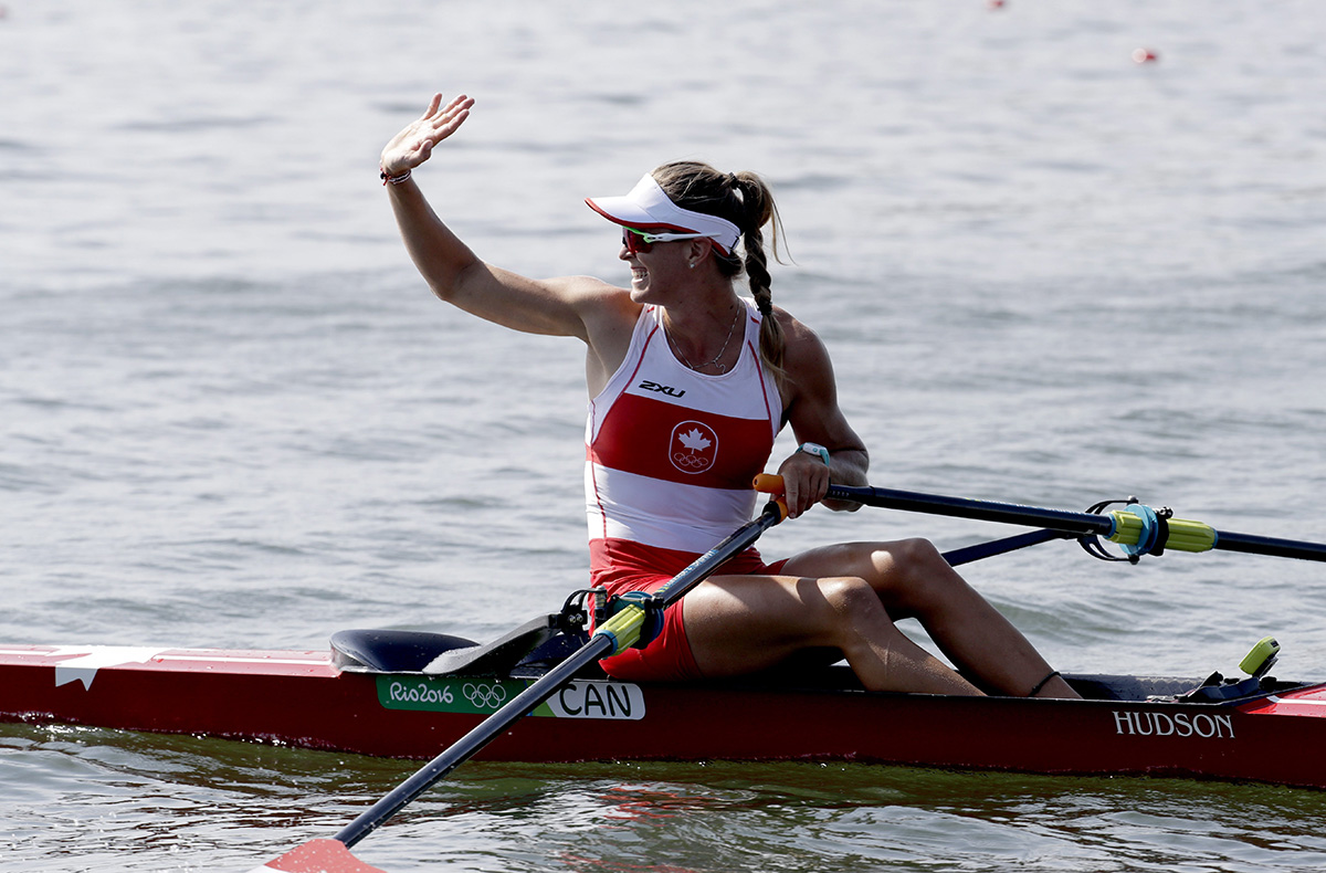 Carling Zeeman, of Canada, waves after competing in the women's single scull heat during the 2016 Summer Olympics in Rio de Janeiro, Brazil, Saturday, Aug. 6, 2016.