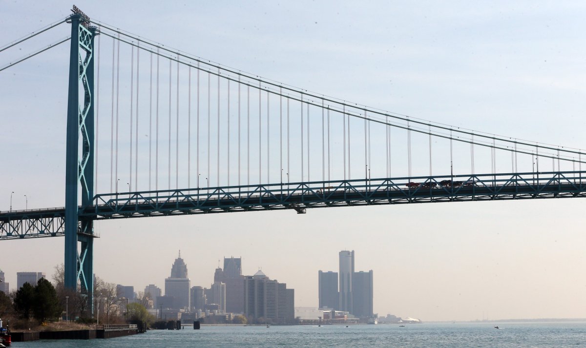 This April 29, 2015 file photo shows the Detroit skyline under the Ambassador Bridge. 