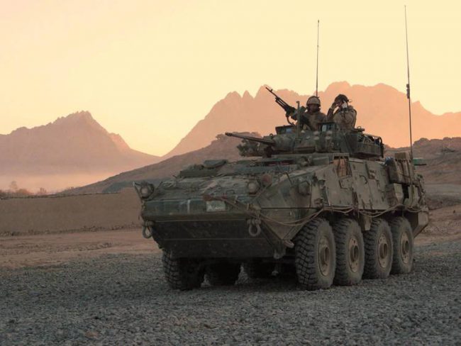 A Canadian light armoured vehicle arrives to escort a convoy at a forward operating base near Panjwaii, Afghanistan in 2006. 