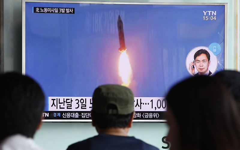 South Koreans watch a North Korean missile launch on September 5, 2016.