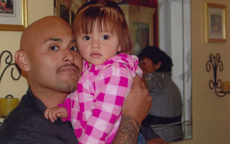 Benny Herrera holding his daughter, Abygail. 