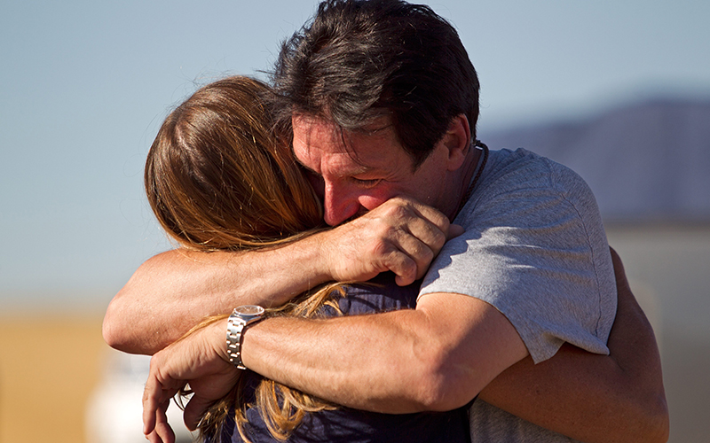 Stuntman Eddie Braun embraces Evel Knievel’s daughter-in-law Shelli Knievel afte rcompleting his flight over the Snake River Canyon in the rocket “Evel Spirit” on Friday, Sept. 16, 2016, at Twin Falls, Idaho.