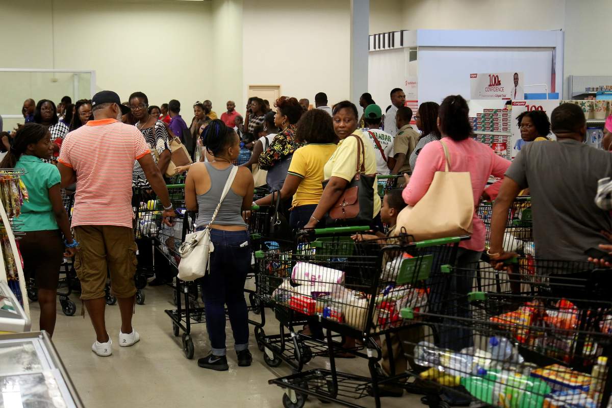 Jamaicans flock to the supermarkets to take care of last minute shopping pending the arrival of Hurricane Matthew in Kingston, Jamaica, September 30, 2016.