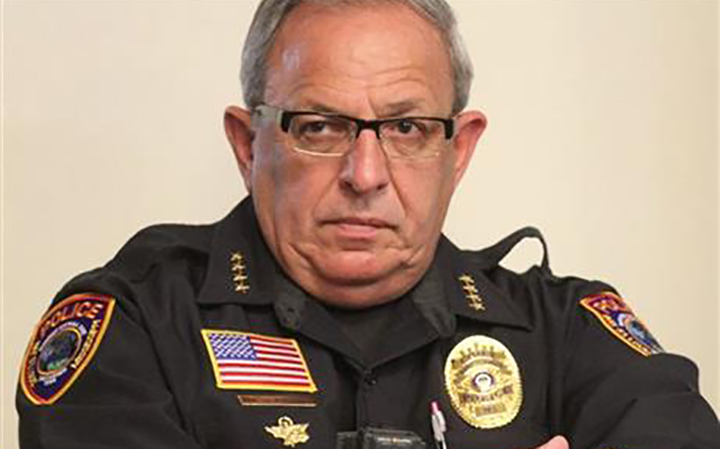 Chief of Police Michael DeNardo listens during a city council meeting in Bay St. Louis, Miss. Hancock County Coroner Jim Faulk said Chief DeNardo died Thursday, Sept. 8, 2016.
