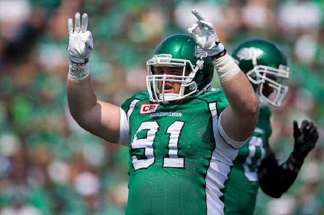 Brandon Tennant looks for a signal from the sideline in a game during his time with the Saskatchewan Roughriders.