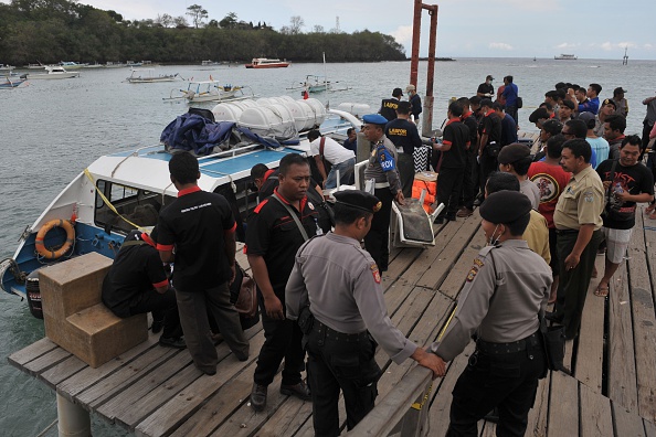 Police conduct investigations on a speedboat following an explosion on the vessel in Karang Asem, Indonesia's resort island of Bali, on September 15, 2016. 

(Photo credit should read STR/AFP/Getty Images).