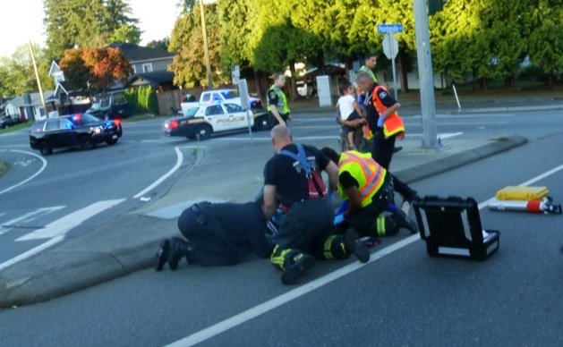 Emergency crews attending to two pedestrians at Bevan Avenue and Peardonville Road. 