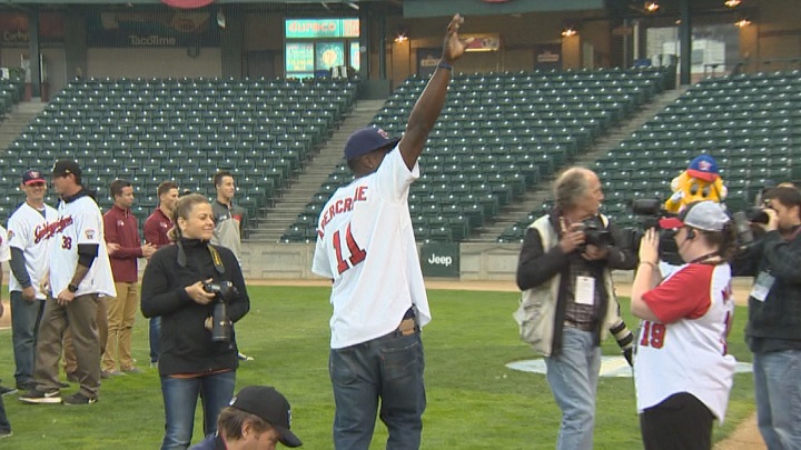 Winnipeg Goldeyes outfielder Reggie Abercrombie waves to the crowd during their championship celebration at Shaw Park.