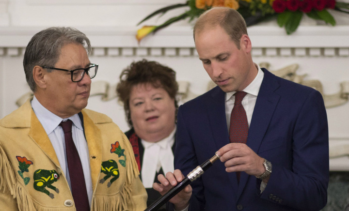 Grand Chief Stewart Philip looks on as the Duke of Cambridge places a Ring of Reconciliation upon the Black Rod during a small ceremony in Victoria, B.C., Monday, Sept 26, 2016.