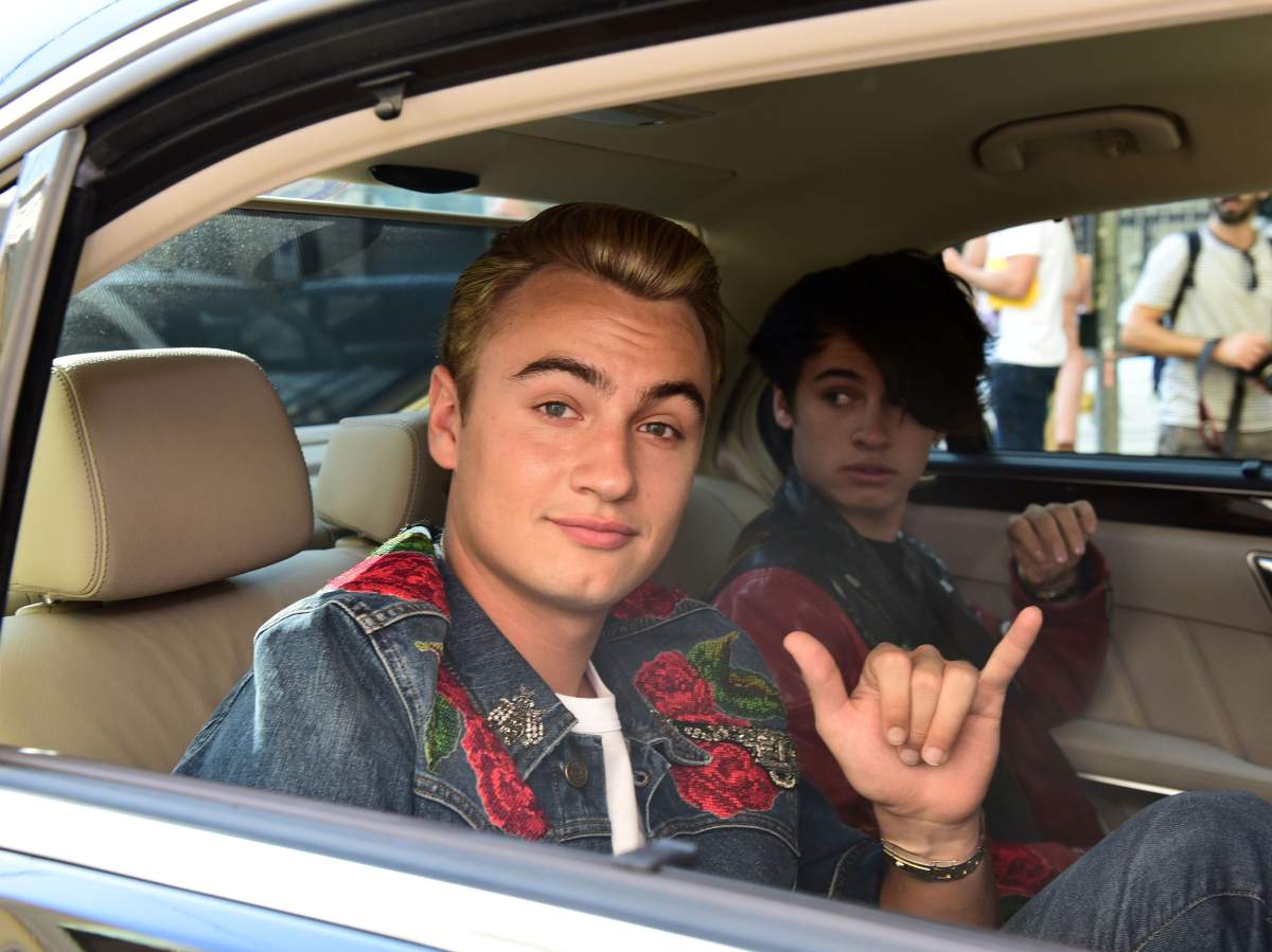 Pamela Anderson and Tommy Lee's sons, Brandon Thomas and Dylan Jagger arrive at the Dolce & Gabbana fashion show during spring 2017 Milan Fashion Week. September 25, 2016.