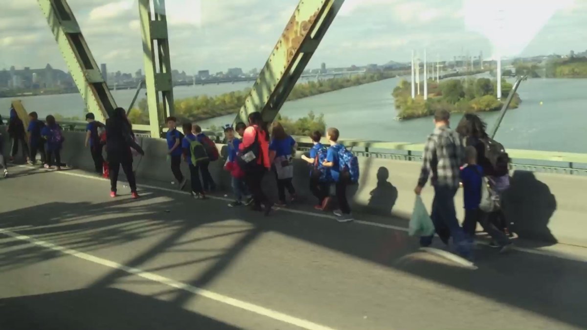 Students are evacuated from a smoking bus on the Champlain Bridge, Wednesday, September 28, 2016.