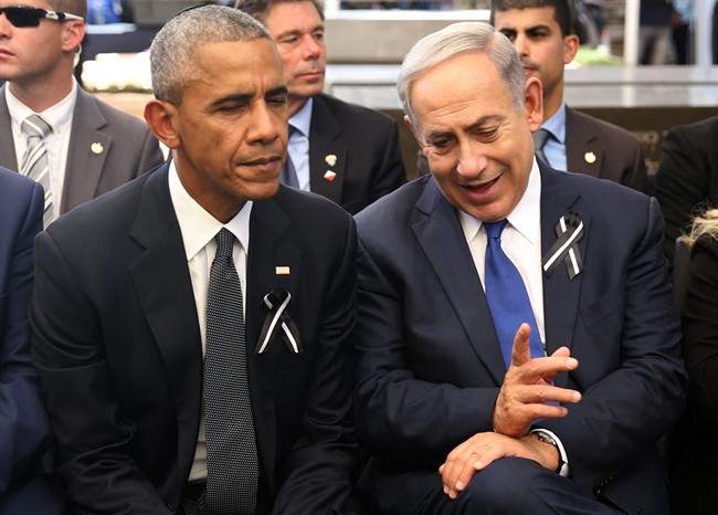 Israeli Prime Minister Benjamin Netanyahu, right, talks with US President Barack Obama at Jerusalem's Mount Herzl national cemetery during the funeral of former Israeli President Shimon Peres, Friday, Sept. 30, 2016. 