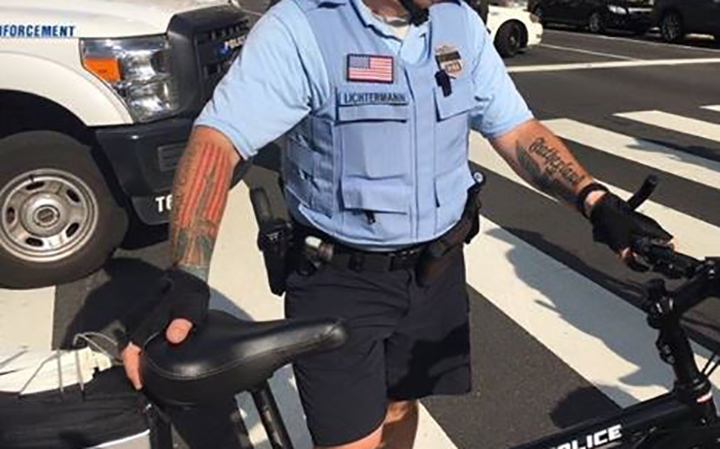 A Philadelphia cop was photographed with tattoos linked to neo-Nazis and white supremacy groups.