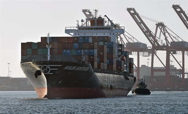 FILE PHOTO: In this Wednesday, Aug. 31, 2016, photo, the container ship Hanjin Montevideo is escorted from the Hanjin Terminal in the Port of Long Beach, in Long Beach, Calif. The facility proposed for Sydney harbour would be capable of handling the largest container ships in the world.