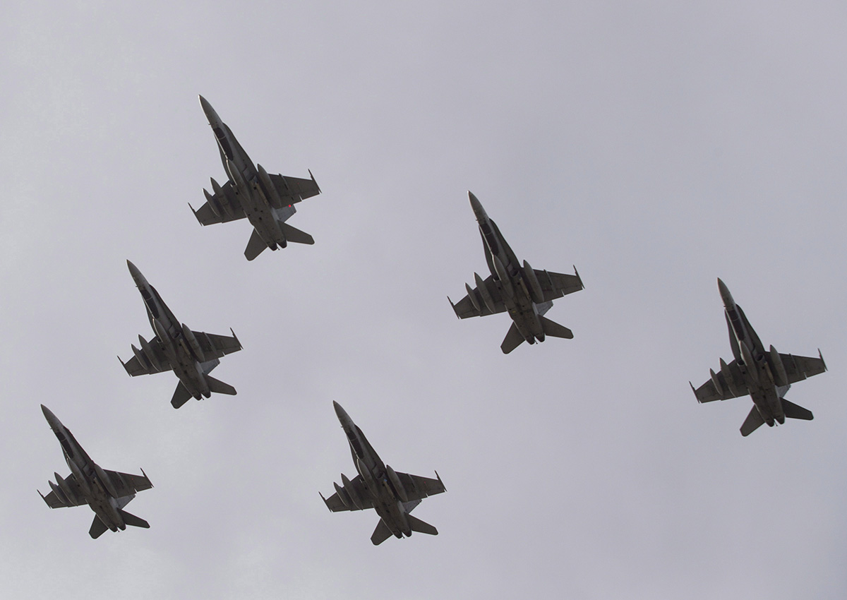 CF-18 Hornets fly in formation on their the departure for Operation IMPACT, in Cold Lake, Alberta in October, 2014. The demo team will be part of the Peterborough Air Show Sept. 21-22.