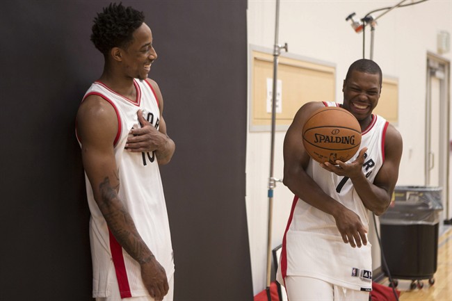 Toronto Raptors' DeMar DeRozan (left) and Kyle Lowry share a joke as they pose for a photoshoot during a media day for the team in Toronto on Monday September 26, 2016.