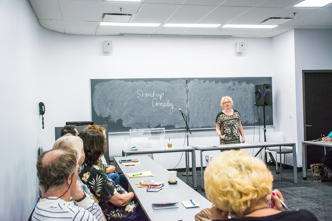 Instructor Janice Bannister introducing her 55+ students to stand-up comedy. 