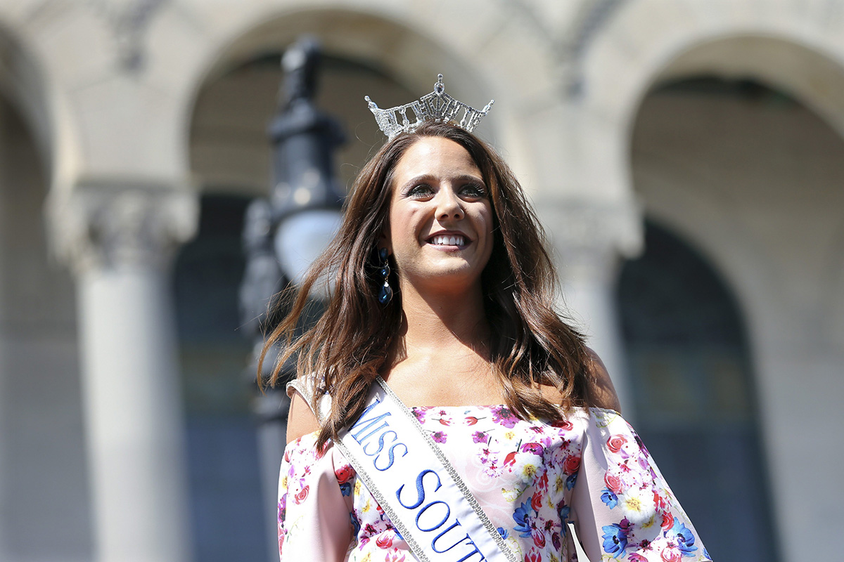 In this Tuesday, Aug. 30, 2016 photograph, Miss South Dakota, Julia Olson is introduced during Miss America Pageant arrival ceremonies in Atlantic City.
