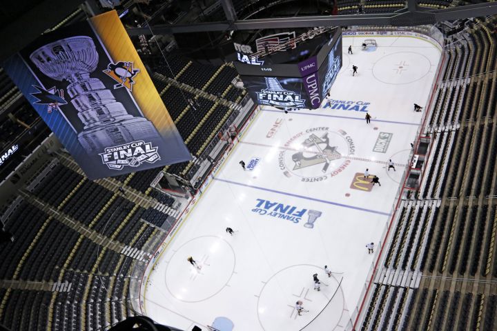 The crowd waves towels and cheers as lasers and spotlights swirl over the  ice at Consol Energy Center before Game 5 of the NHL hockey Stanley Cup  Eastern Conference finals between the