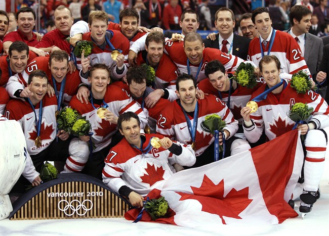 Team Canada poses for a photo after winning the gold medal game against the USA in the men's ice hockey gold medal final at the 2010 Winter Olympic Games in Vancouver, Sunday, Feb. 28, 2010. 
