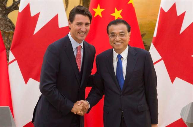 Chinese Premier Li Keqiang, right, shakes hands with Canadian Prime Minister Justin Trudeau following a joint news conference at the Great Hall of the People in Beijing, China, Wednesday, Aug. 31, 2016.