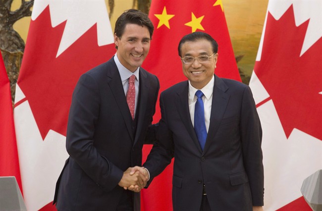 Chinese Premier Li Keqiang, right, shakes hands with Canadian Prime Minister Justin Trudeau following a joint news conference at the Great Hall of the People in Beijing, China, Wednesday, Aug. 31, 2016.