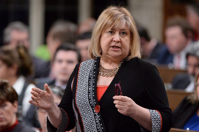 Labour Minister MaryAnn Mihychuk answers a question during Question Period in the House of Commons on Parliament Hill in Ottawa on Thursday, May 5, 2016. Federal officials are set to tighten labour rules to make it tougher for large, federally regulated companies to conduct mass layoffs without warning. THE CANADIAN PRESS/Adrian Wyld.