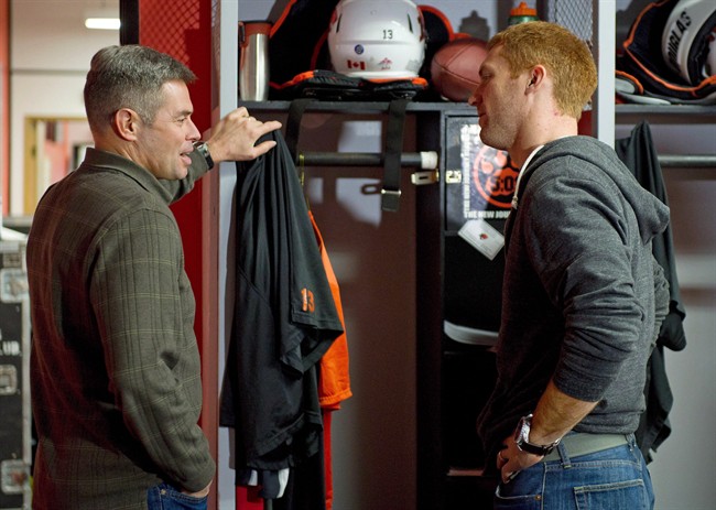 B.C. Lions quarterback Travis Lulay (right) and Jacques Chapdelaine offensive coordinator and quarterbacks coach talk at the team’s practice facility in Surrey, B.C., November 20, 2012.