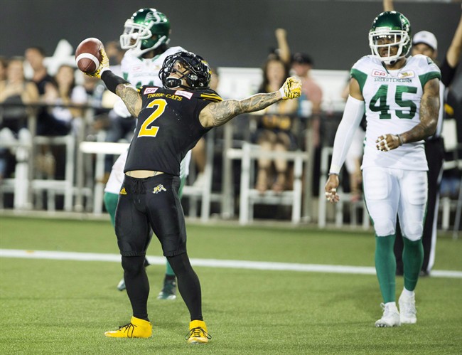 Hamilton Tiger-Cats slotback Chad Owens (2) celebrates a touchdown late in the first half of CFL football action against the Saskatchewan Roughriders in Hamilton on August 20, 2016. 