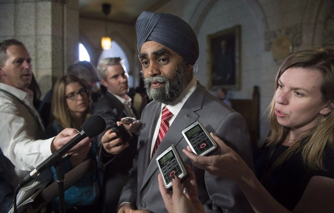 Minister of National Defence Minister Harjit Sajjan speaks with the media before Question Period on Parliament Hill in a June 15, 2016, file photo.