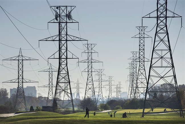 Hydro towers are seen over a golf course in Toronto on Wednesday, November 4, 2015. 