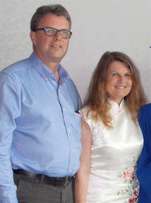 Kevin and Julia Garratt are shown in an undated photo. The Canadian couple say they were detained by China and interrogated for six hours every day.