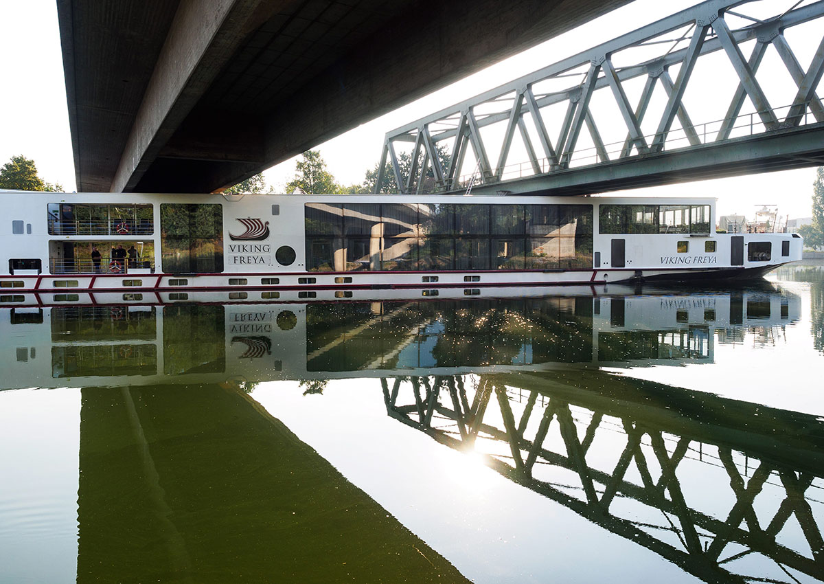 A river cruise ship sticks underneath a railway bridge on the Main-Danube Canal near Erlangen, Germany, Sunday Sept. 11, 2016. 