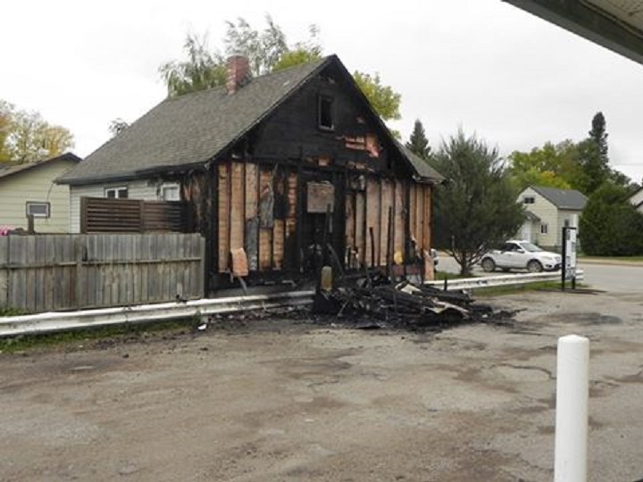 A Dauphin mother and three children escaped from their burning house after RCMP came in awoke them from their sleep Sunday.