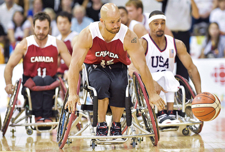 Canada's David Eng chases down a loose ball against the United States during second-half men's gold medal wheelchair basketball action at the Parapan Am Games in Toronto on Saturday, August 15, 2015. Eng will carry Canada's flag into the opening ceremony of the Rio Paralympics. 