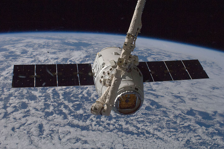 The Dragon spacecraft is grappled by the space station’s Canadarm2 on October 10, 2012.