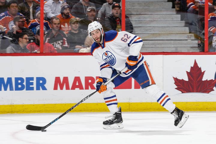 Eric Gryba #62 of the Edmonton Oilers skates with the puck against the Ottawa Senators during an NHL game at Canadian Tire Centre on February 4, 2016 in Ottawa.