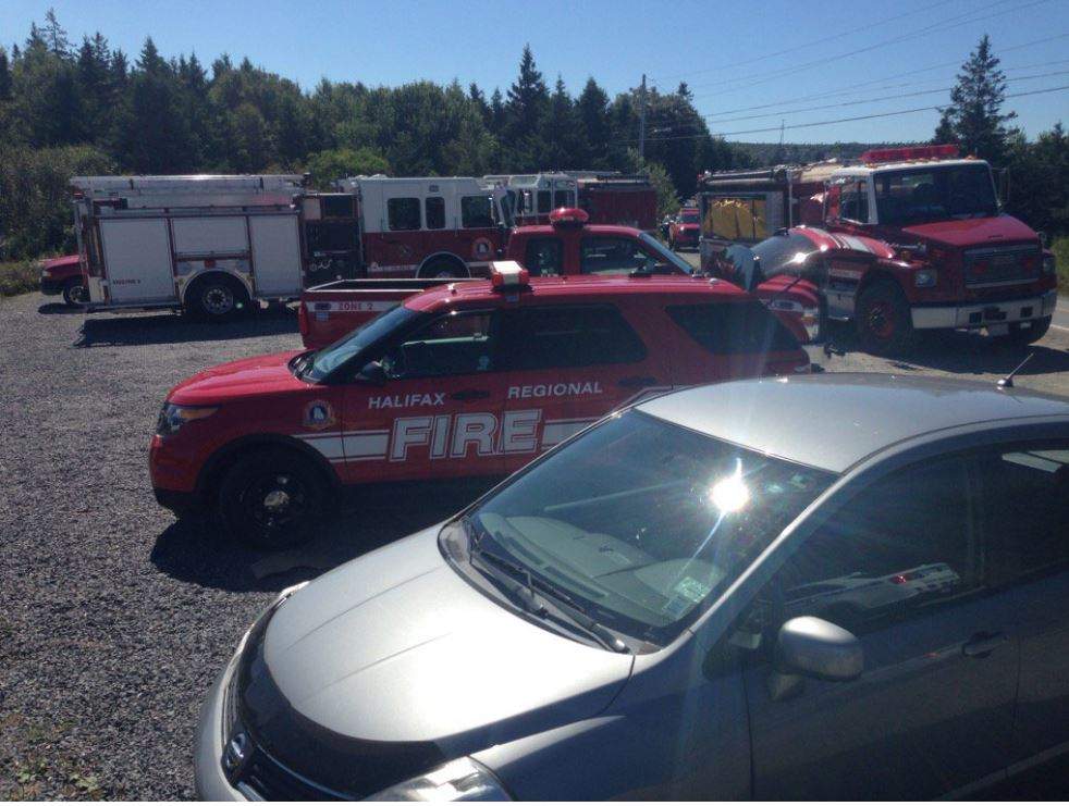 Officials are working to contain a fire in the woods off John Brackett Drive in Herring Cove, N.S. 