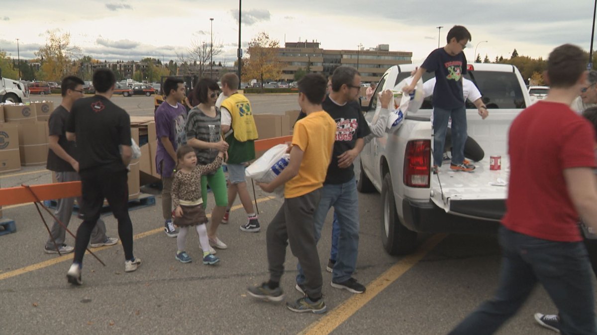 Volunteers unload truckloads of donations picked up from 198 communities across Calgary.