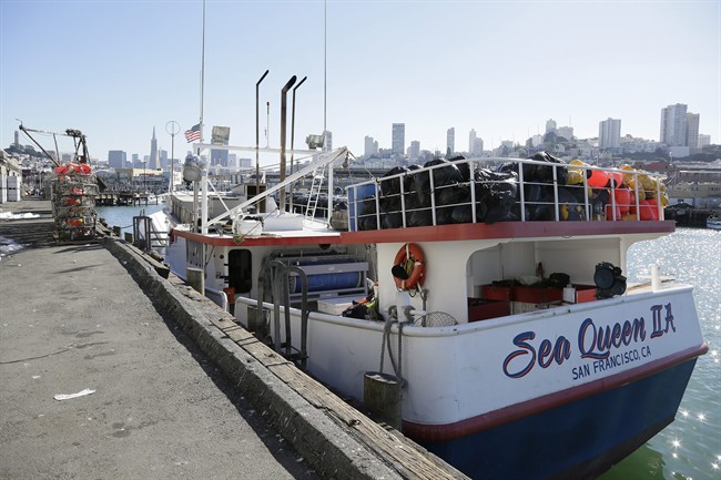In this photo taken Friday, Nov. 6, 2015, is the Sea Queen II docked at Fisherman's Wharf in San Francisco. Abdul Fatah and Sorihin, Indonesian fishermen who escaped slavery aboard the Honolulu-based tuna and swordfish vessel when it docked at San Francisco's Fisherman's Wharf are suing the boat's owner for tricking them into accepting dangerous jobs they say they weren't allowed to leave. Attorneys for the fisherman said in a lawsuit filed in federal court Thursday, Sept. 22, 2016, that they were recruited in Indonesia years ago to work in Hawaii's commercial fishing fleet without realizing they would never be allowed onshore.