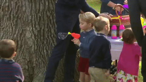 Prince George grabs an orange bubble gun and decides to test just how many bubbles it can blow.