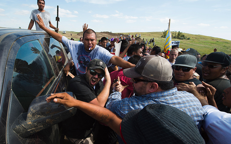 A protestor is treated after being pepper sprayed by private security contractors on land being graded for the Dakota Access Pipeline (DAPL) oil pipeline, near Cannon Ball, North Dakota, September 3, 2016.