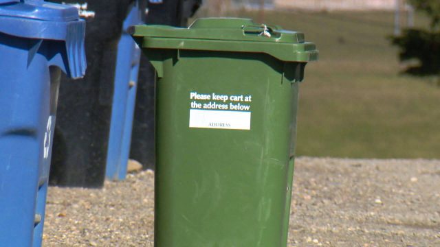 A green cart composting bin is shown in Calgary. 
