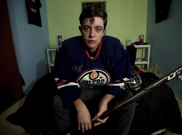 Jesse Thompson, 17, poses for a photograph in his room in Oshawa, Ont., on Monday, September, 15 2014. Thompson is a transgender hockey player who fought for his rights against Hockey Canada. 