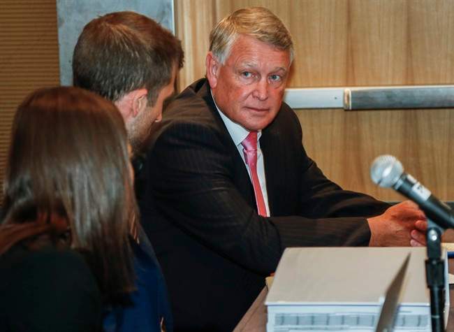 Federal Court Justice Robin Camp takes his seat at a Canadian Judicial Council inquiry in Calgary, Alta., Tuesday, Sept. 6, 2016.