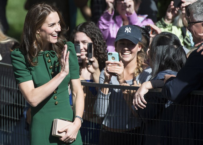 The Duchess of Cambridge waves to people at the University of British Columbia campus in Kelowna, B.C., Tuesday, Sept 27, 2016. 